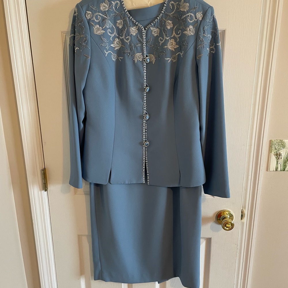 Two piece formal set. Long skirt and beaded jacket